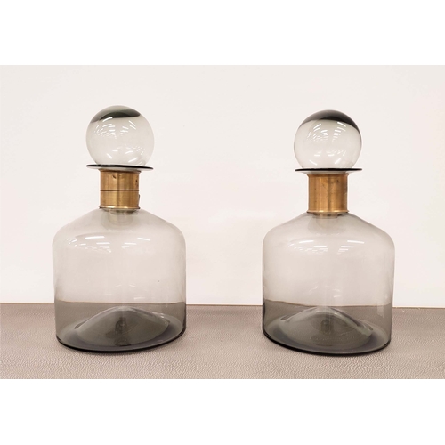 387 - MURANO STYLE GLASS DECANTERS, a pair, smoked glass with a gilt metal collars, 36cm H. (2)