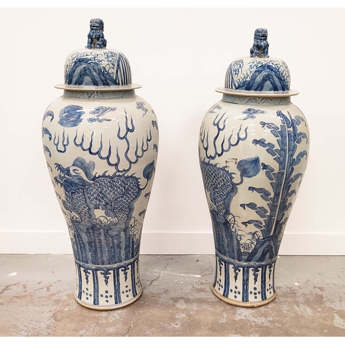 403 - TEMPLE JARS, a pair, Chinese style blue and white ceramic, 110cm H x 42cm W. (2)