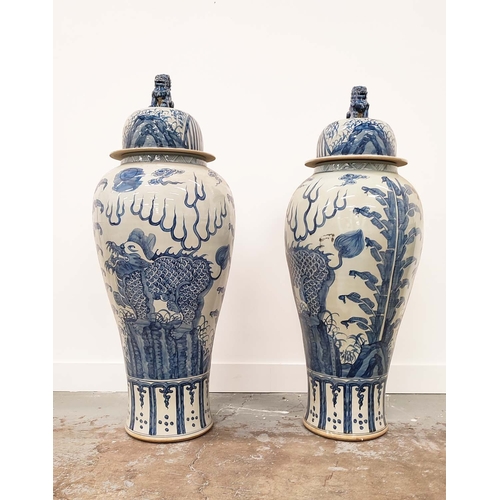 403 - TEMPLE JARS, a pair, Chinese style blue and white ceramic, 110cm H x 42cm W. (2)