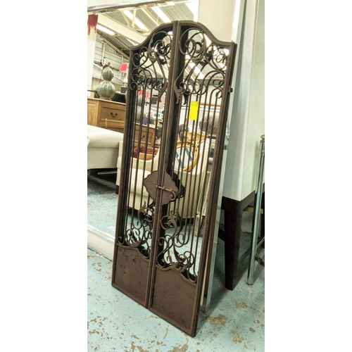 407 - GARDEN MIRRORS, a pair, metal gate frames, 130cm H x 32cm W.