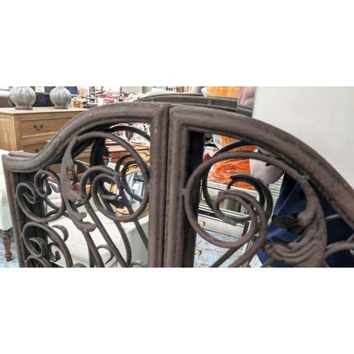 407 - GARDEN MIRRORS, a pair, metal gate frames, 130cm H x 32cm W.