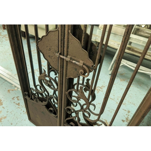 407 - GARDEN MIRRORS, a pair, metal gate frames, 130cm H x 32cm W.