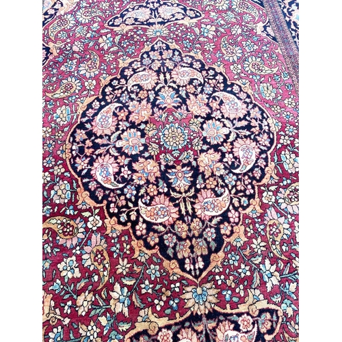 51 - ANTIQUE PERSIAN ISFAHAN RUG, 230cm x 140cm.