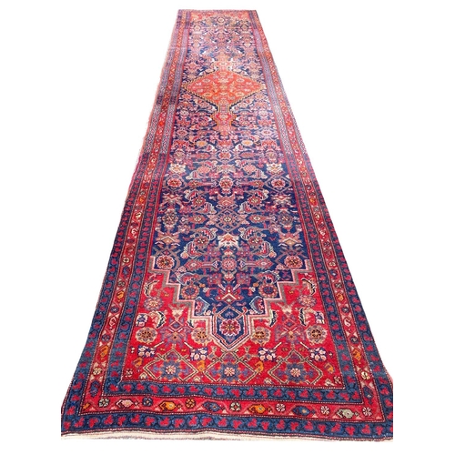 57 - ANTIQUE NORTH WEST PERSIAN FEREGHAN RUNNER, 490cm x 109cm.