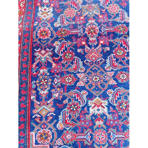 57 - ANTIQUE NORTH WEST PERSIAN FEREGHAN RUNNER, 490cm x 109cm.