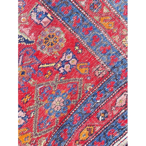 57 - ANTIQUE NORTH WEST PERSIAN FEREGHAN RUNNER, 490cm x 109cm.