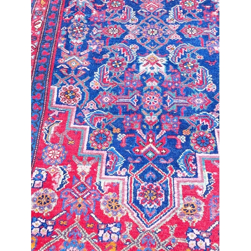 57 - ANTIQUE NORTH WEST PERSIAN FEREGHAN RUNNER, 490cm x 109cm.