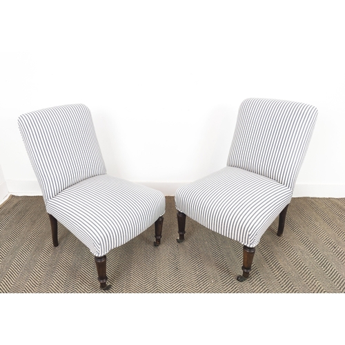 69 - SLIPPER CHAIRS, a pair, Napoleon III beechwood in new ticking with front castors, 83cm H x 51cm W x ... 