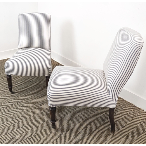 69 - SLIPPER CHAIRS, a pair, Napoleon III beechwood in new ticking with front castors, 83cm H x 51cm W x ... 