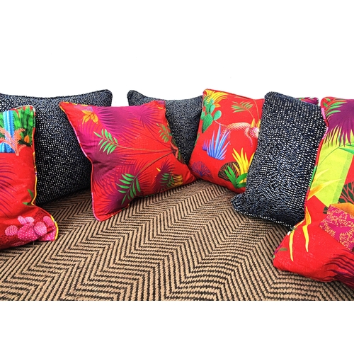 71 - CUSHIONS, seven, comprising three blue chenille and four red palm design fabric, 42cm square. (7)