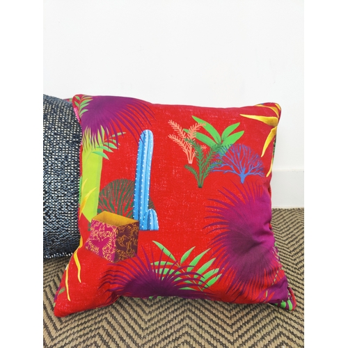 71 - CUSHIONS, seven, comprising three blue chenille and four red palm design fabric, 42cm square. (7)