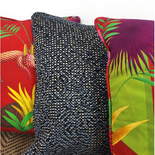 71 - CUSHIONS, seven, comprising three blue chenille and four red palm design fabric, 42cm square. (7)