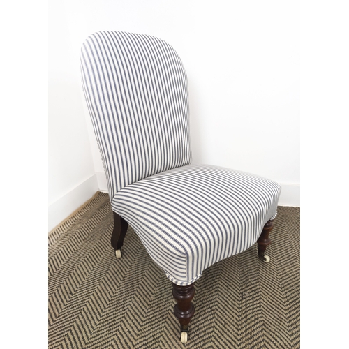 72 - SLIPPER CHAIR, Victorian walnut in blue and white ticking with ceramic castors, 81cm H x 52cm W x 56... 