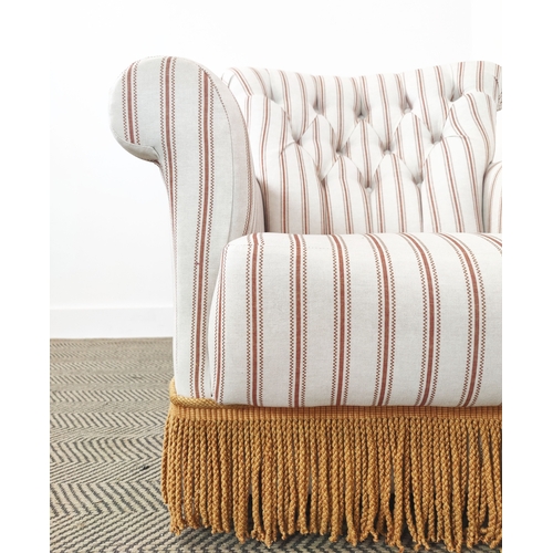 73 - BOUDOIR CHAIR, buttoned cream striped and orange tasselled upholstery on castors, 78cm H x 77cm W x ... 