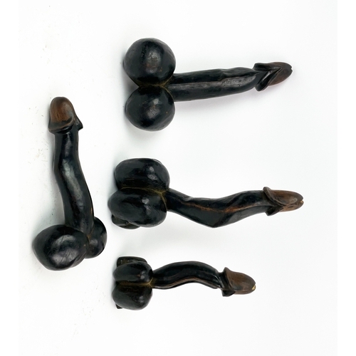 15 - CARVED WOODEN PHALLUSES, Cameroon, four, 33cm L (13 inches). (4)