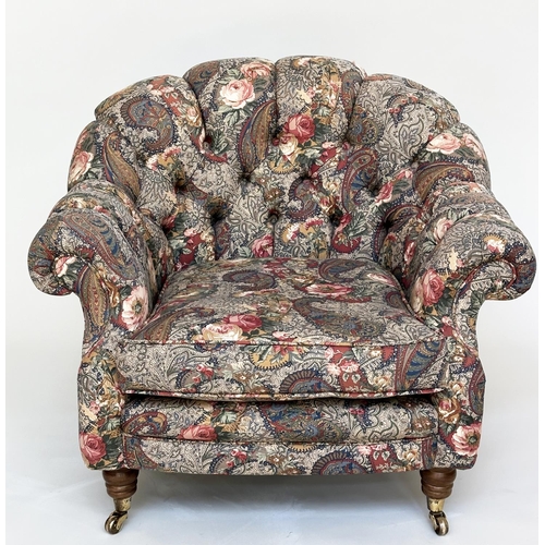 105 - ARMCHAIR, Victorian manner with Liberty style deep buttoned upholstery, with arched back and turned ... 