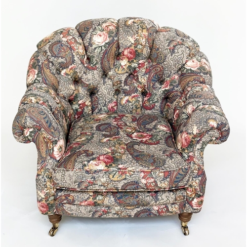 105 - ARMCHAIR, Victorian manner with Liberty style deep buttoned upholstery, with arched back and turned ... 