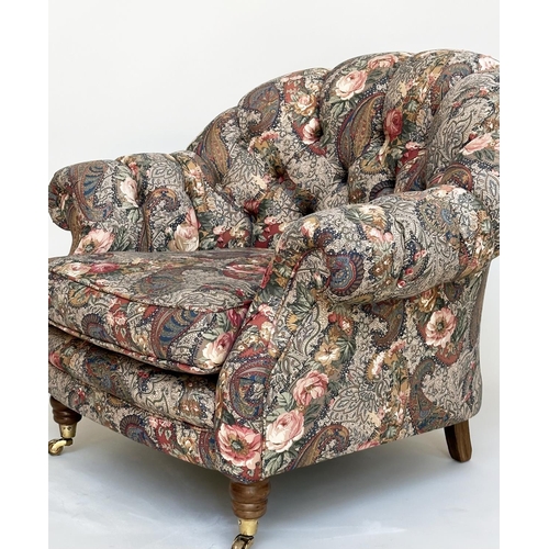 105 - ARMCHAIR, Victorian manner with Liberty style deep buttoned upholstery, with arched back and turned ... 