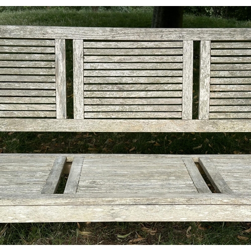 111 - GARDEN BENCH, early 20th century English well weathered teak with close strutted seats and back pane... 