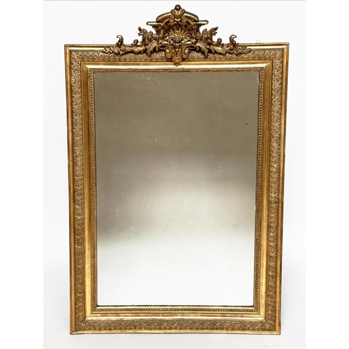 82 - WALL MIRROR, 19th century French giltwood, rectangular with gesso beaded and foliate frame and shell... 