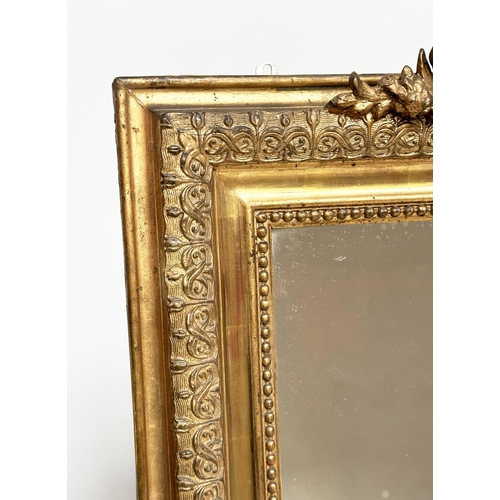 82 - WALL MIRROR, 19th century French giltwood, rectangular with gesso beaded and foliate frame and shell... 