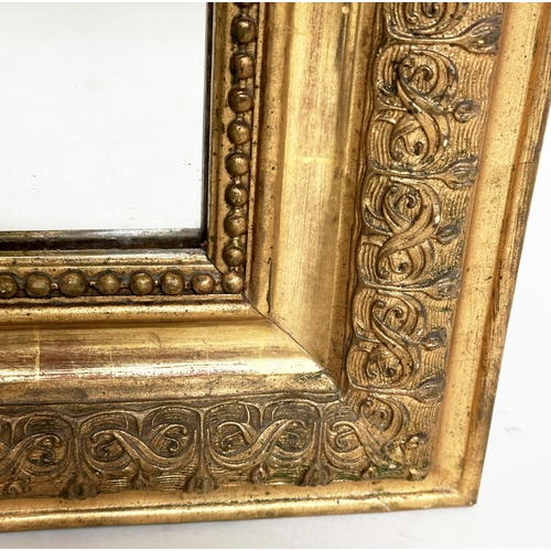 82 - WALL MIRROR, 19th century French giltwood, rectangular with gesso beaded and foliate frame and shell... 