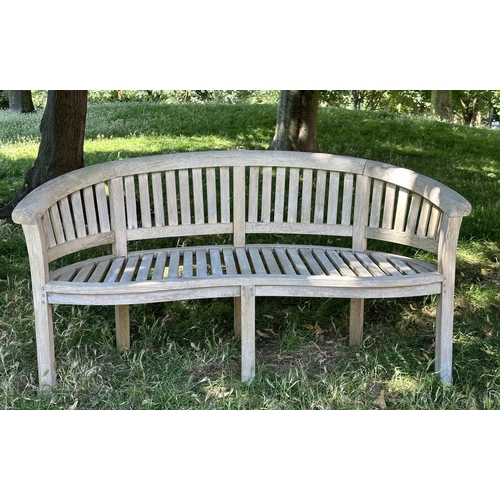 118 - BANANA GARDEN BENCH, well weathered teak, slatted and dowelled with curved back, 160cm W.