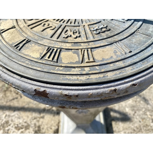 180 - SUNDIAL, early 20th century cast iron with bronze dial, 95cm H x 35cm W x 35cm D.