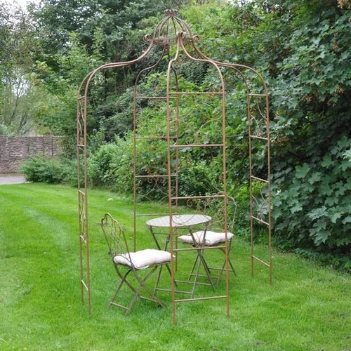 181 - ARCHITECTURAL GARDEN PERGOLA, Regency style metal with a rusted finish, 275cm H x 155cm W x 155cm D.