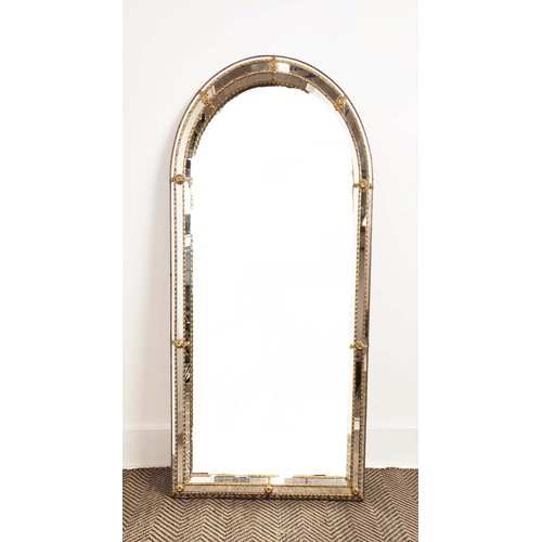 177 - WALL MIRROR, gilt metal arched with raised cushion border, 112cm x H 60cm W.