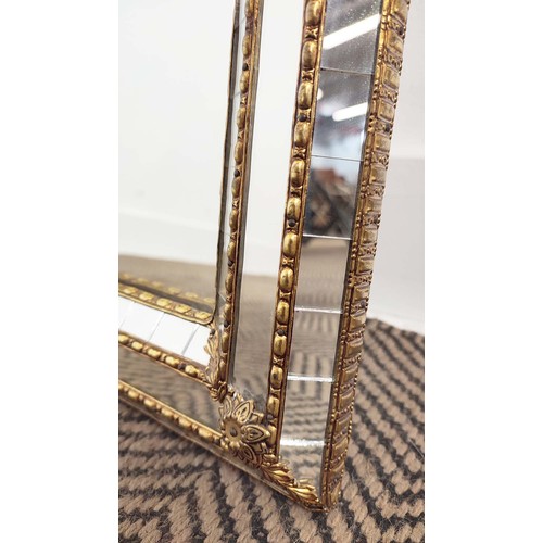 177 - WALL MIRROR, gilt metal arched with raised cushion border, 112cm x H 60cm W.