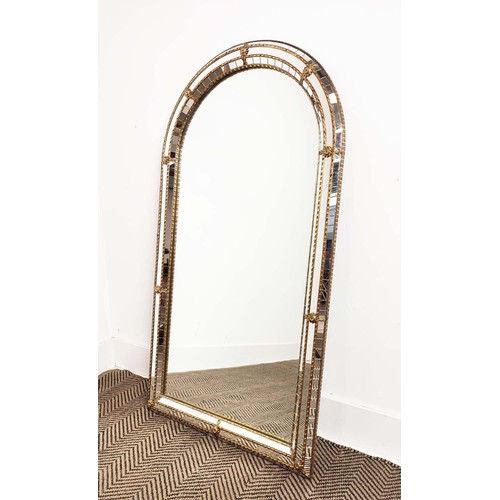 177 - WALL MIRROR, gilt metal arched with raised cushion border, 112cm x H 60cm W.