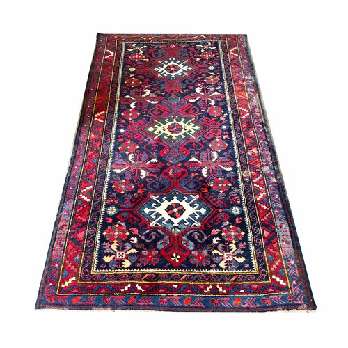 66 - CAUCASIAN RUG, 220cm x 121cm.