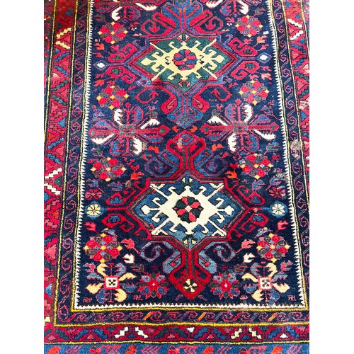 66 - CAUCASIAN RUG, 220cm x 121cm.