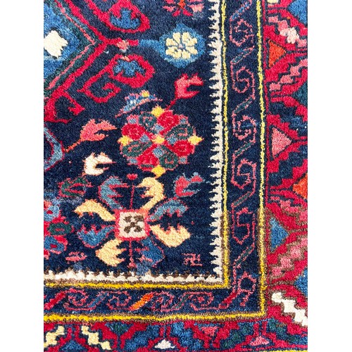 66 - CAUCASIAN RUG, 220cm x 121cm.