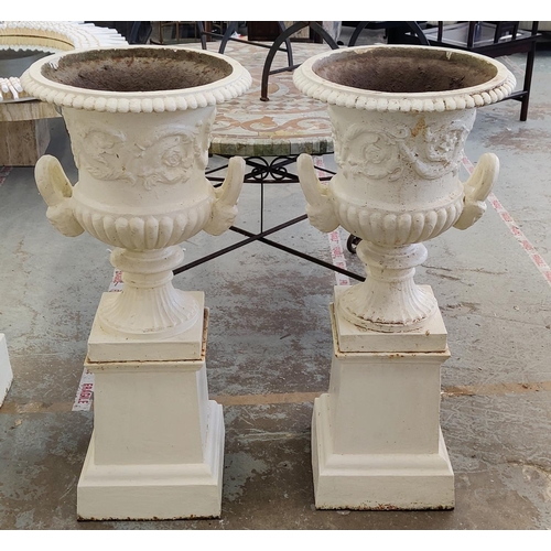 161 - GARDEN URNS, a pair, Victorian cream painted cast iron of campana form on plinths, 100cm H x 46cm D.... 