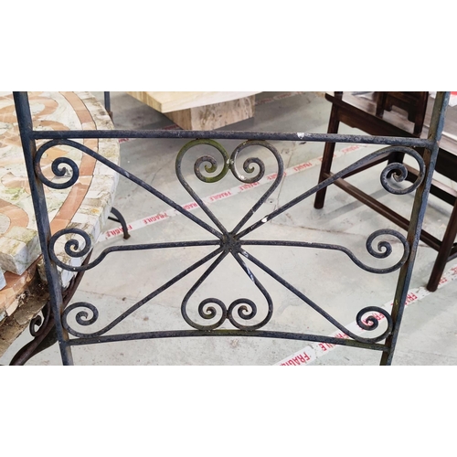 163 - GARDEN TABLE, circular stone mosaic on iron supports, 74cm H x 126cm D and a pair of folding metal c... 