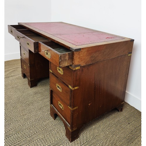 79 - CAMPAIGN STYLE PEDESTAL DESK, three frieze drawers above six drawers with tooled red leather top, 73... 