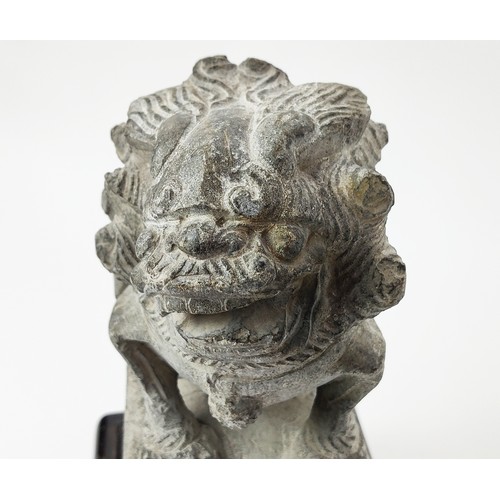 31A - A GREY STONE CARVED RELIEF OF A MYTHICAL BEAST, Ming Dynasty style, together with a pair of carved s... 