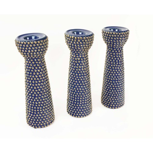 390 - CANDLESTICKS, a set of three, glazed ceramic, 30cm H. (3)