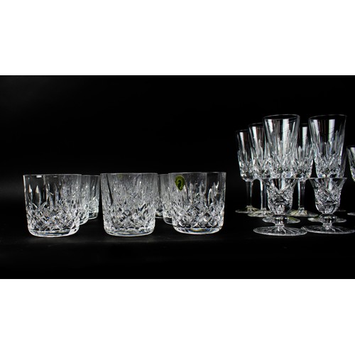 16 - WATERFORD GLASSWARE, a large collection comprising six champagne flutes, six white wine glasses, twe... 