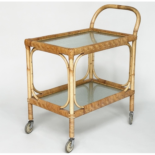 107 - TEA TROLLEY, mid 20th century rattan framed and cane bound with two ripple glass shelves and castors... 