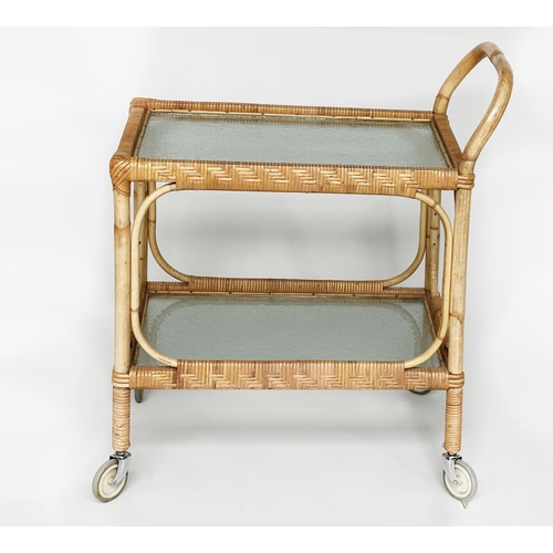 107 - TEA TROLLEY, mid 20th century rattan framed and cane bound with two ripple glass shelves and castors... 