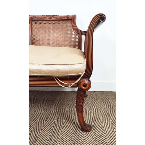 127 - BERGERE SOFA, Regency style beechwood, ebonised and caned with squab cushion, 86cm H x 136cm W x 68c... 