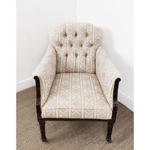 128 - ARMCHAIR, late Victorian mahogany in patterned cream upholstery on front castors, 87cm H x 67cm W.