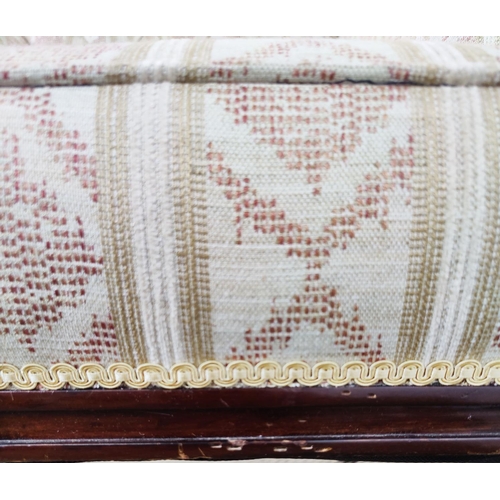 128 - ARMCHAIR, late Victorian mahogany in patterned cream upholstery on front castors, 87cm H x 67cm W.