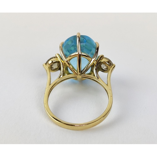 13 - AN 18CT YELLOW GOLD BLUE TOPAZ AND DIAMOND DRESS RING, the central mixed cut topaz of approximately ... 