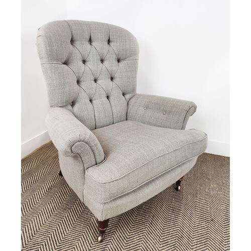 130 - ARMCHAIR, Victorian style in grey fabric with brass front castors, 101cm H x 86cm W x 90cm D.