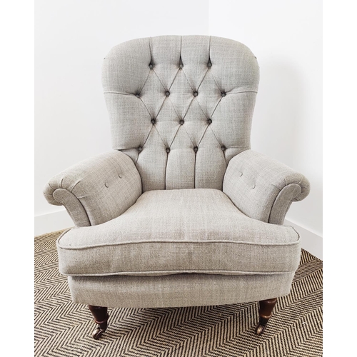 130 - ARMCHAIR, Victorian style in grey fabric with brass front castors, 101cm H x 86cm W x 90cm D.