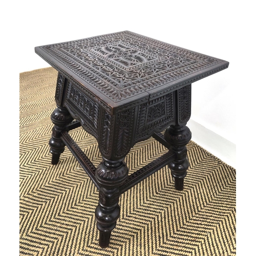 131 - STOOL, late 19th century ebonised with all over low relief carving, 55cm H x 46cm W x 37cm D.